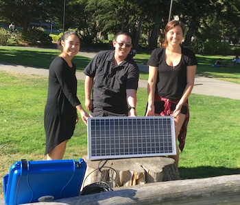 Environmental Studies students with a small solar panel on the quad. Credit: Dr. Ernita Joaquin.